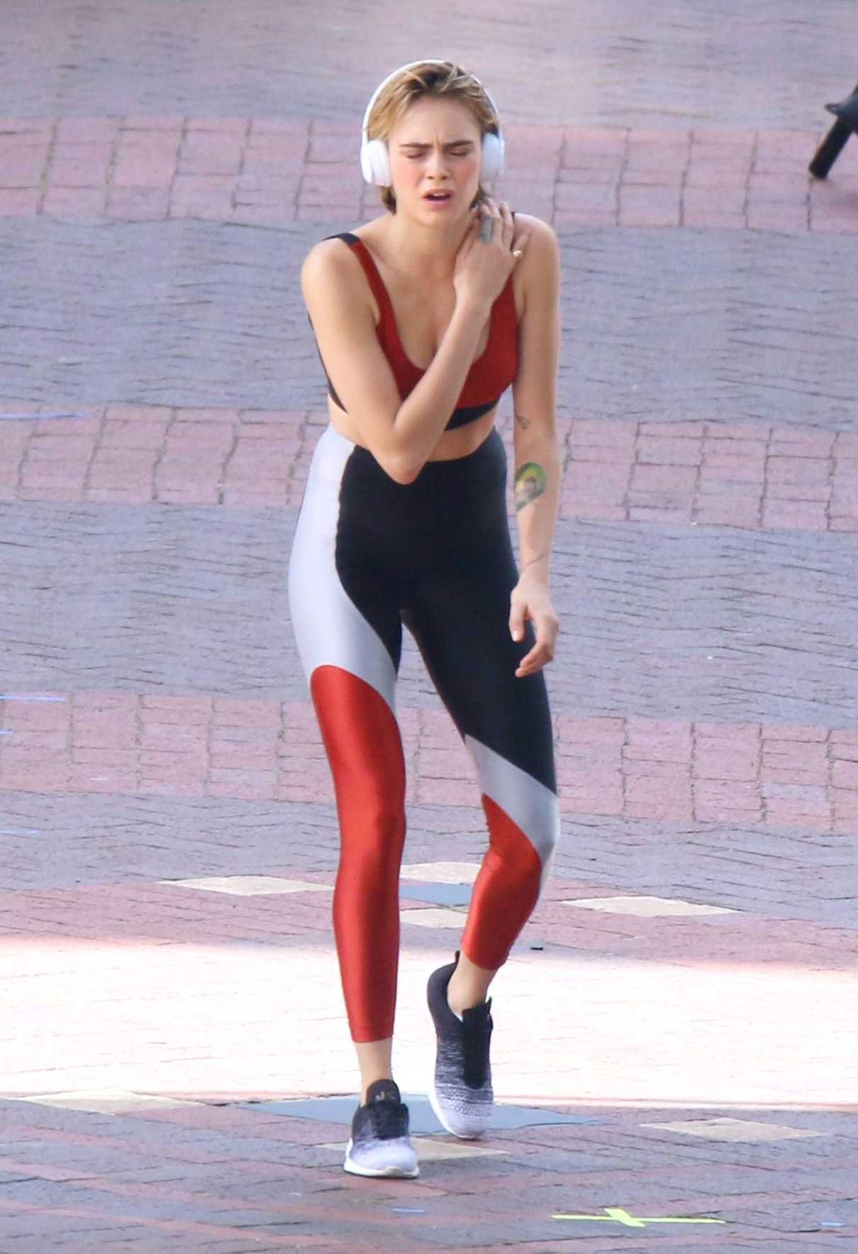 Cara Delevingne in a Red Sports Bra on the Set of Volkswagen Commercial