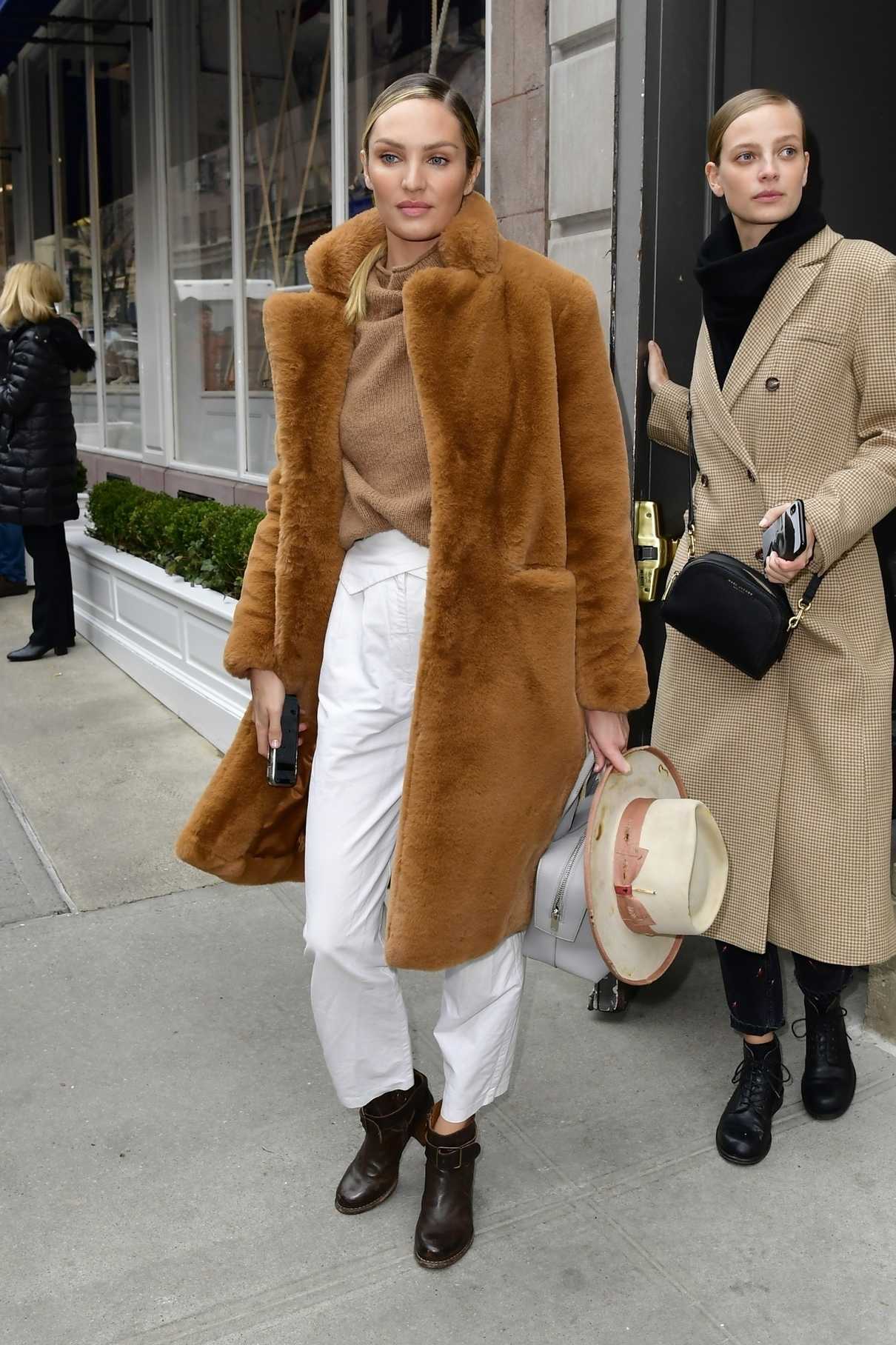 Candice Swanepoel Leaves the Ralph Lauren Show During NYFW in NYC 02/07