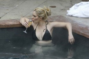 HEIDI MONTAG in Bikini on the Pool in Aspen-6