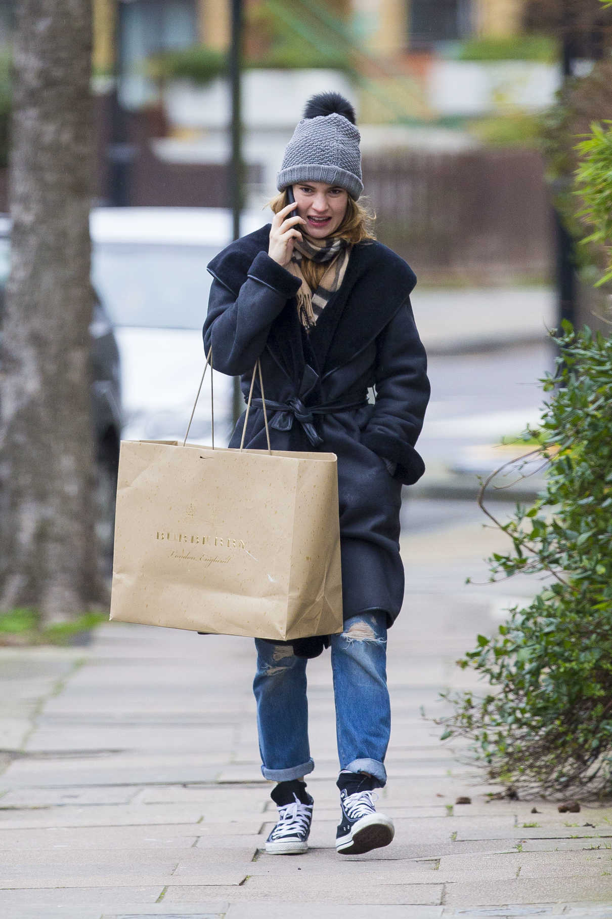 Lily James Goes Shopping in London 01/16/2017-2