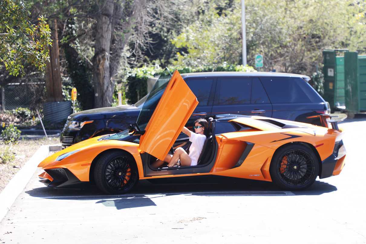 Kylie Jenner Stepping Out of Her Orange Lamborghini in Los Angeles 03/11/2017-2