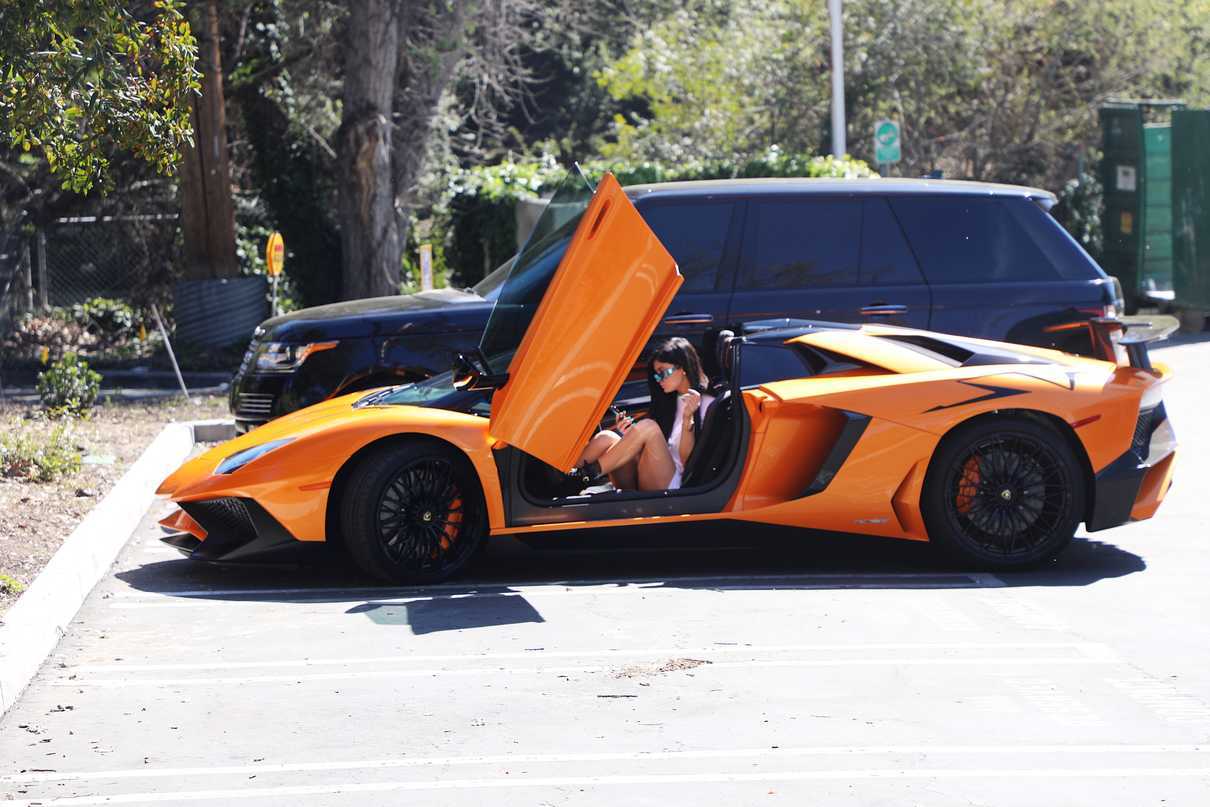 Kylie Jenner Stepping Out of Her Orange Lamborghini in Los Angeles 03/11/2017-3