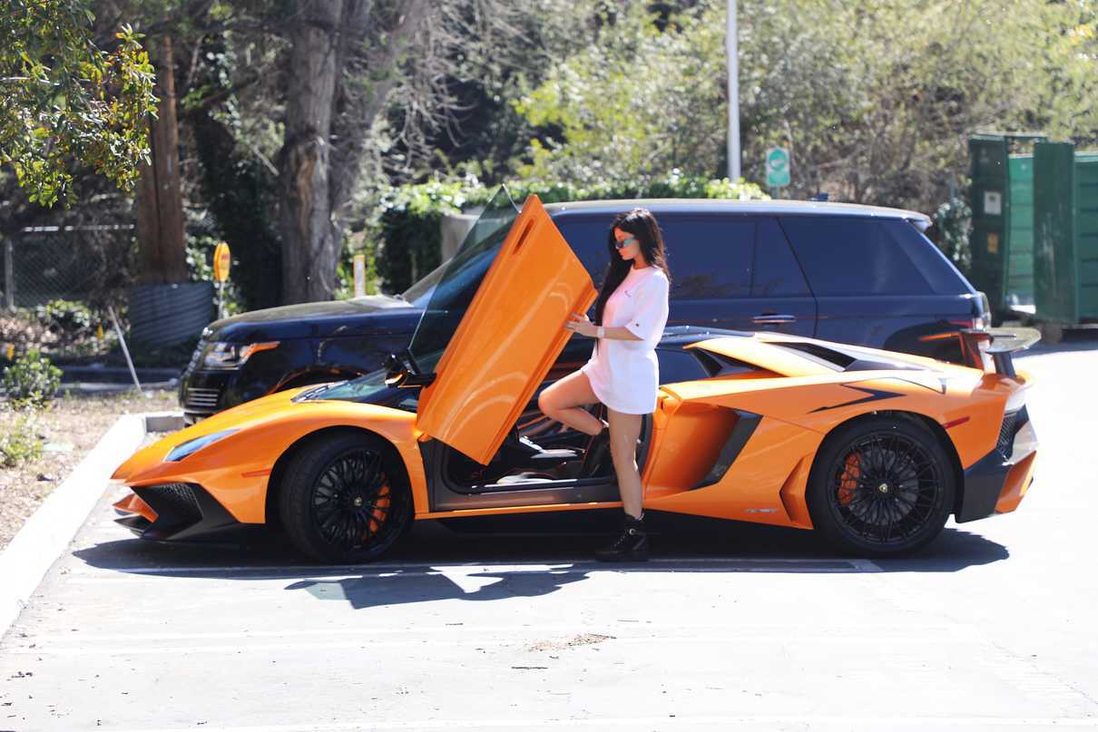 Kylie Jenner Stepping Out of Her Orange Lamborghini in Los Angeles 03/11/2017-5