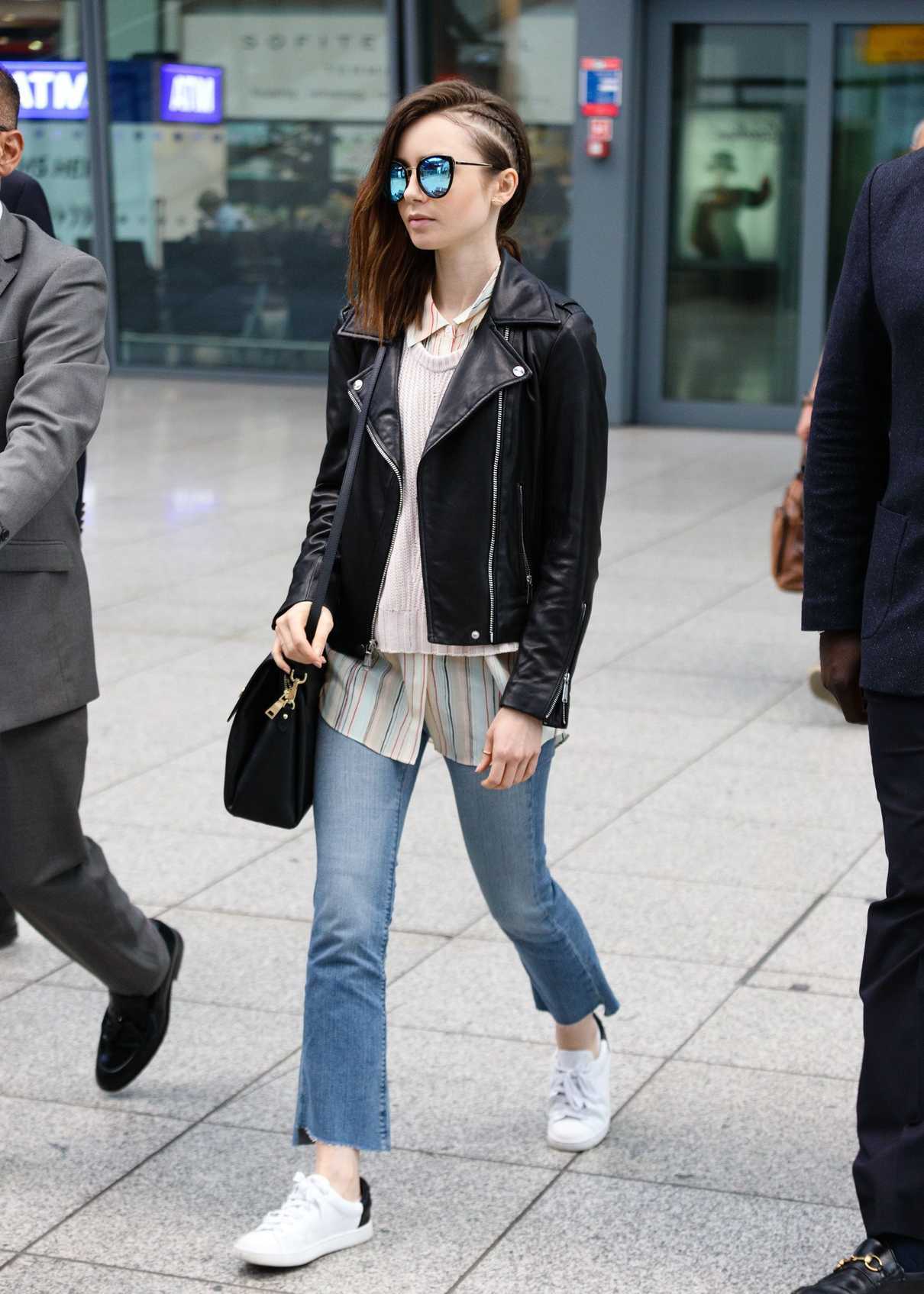 Lily Collins Arrives at Heathrow Airport in London 05/23/2017-3