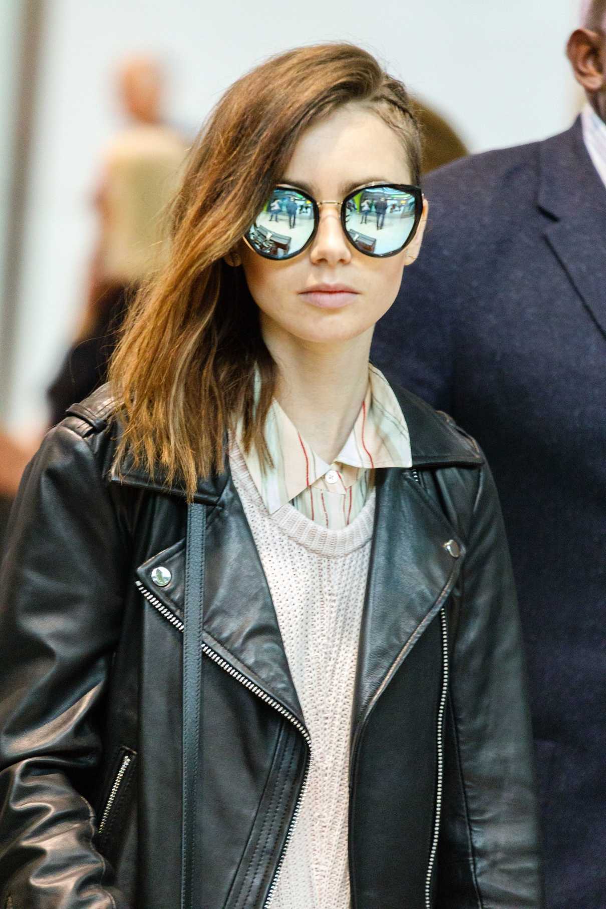 Lily Collins Arrives at Heathrow Airport in London 05/23/2017-4