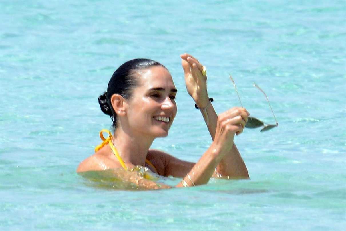 Jennifer Connelly in Yellow Bikini at a Beach in Ibiza 08/17/2017-5