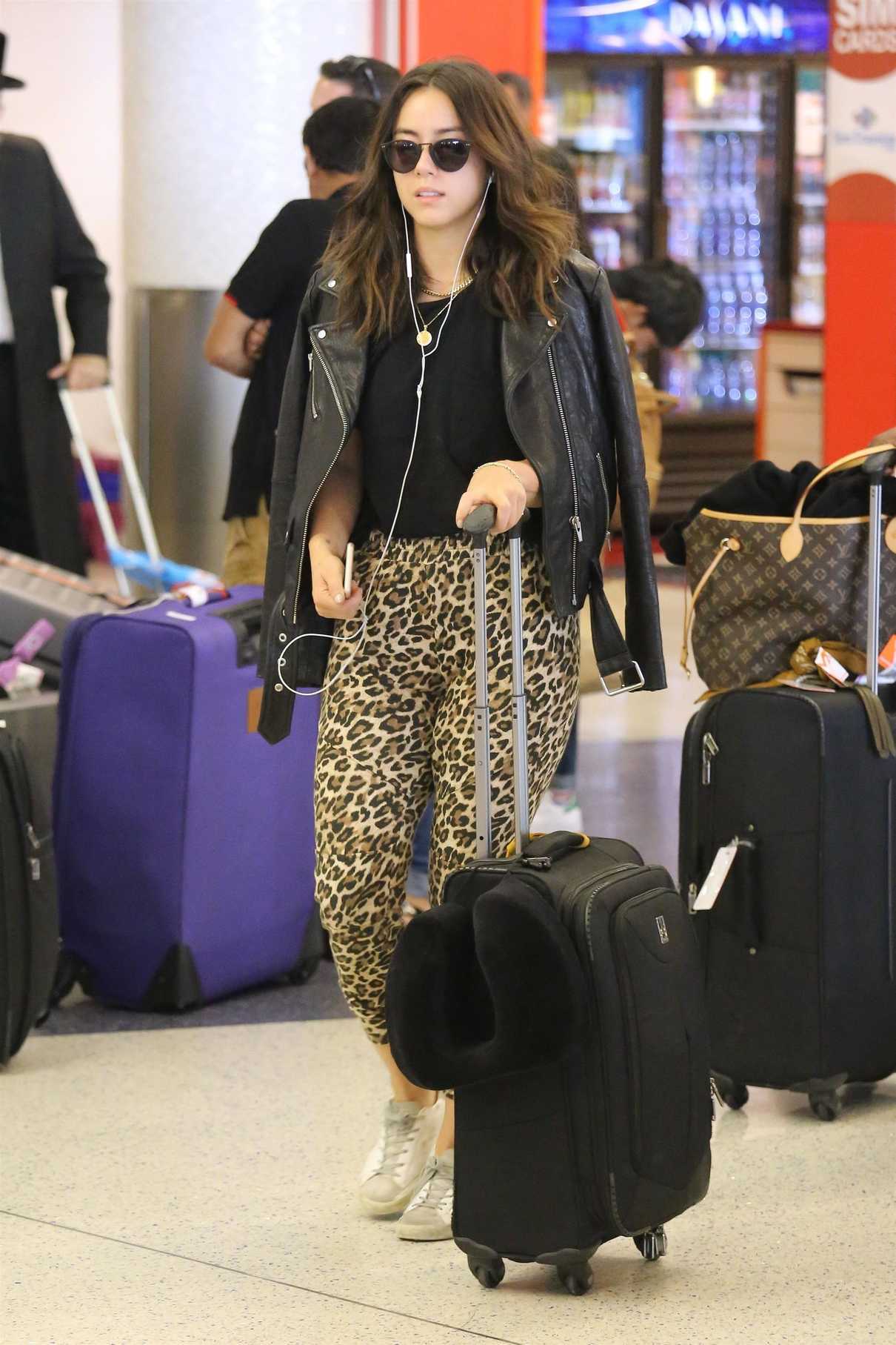 Chloe Bennet Wears a Leopard Print Pants at LAX Airport in LA 09/10/2017-2