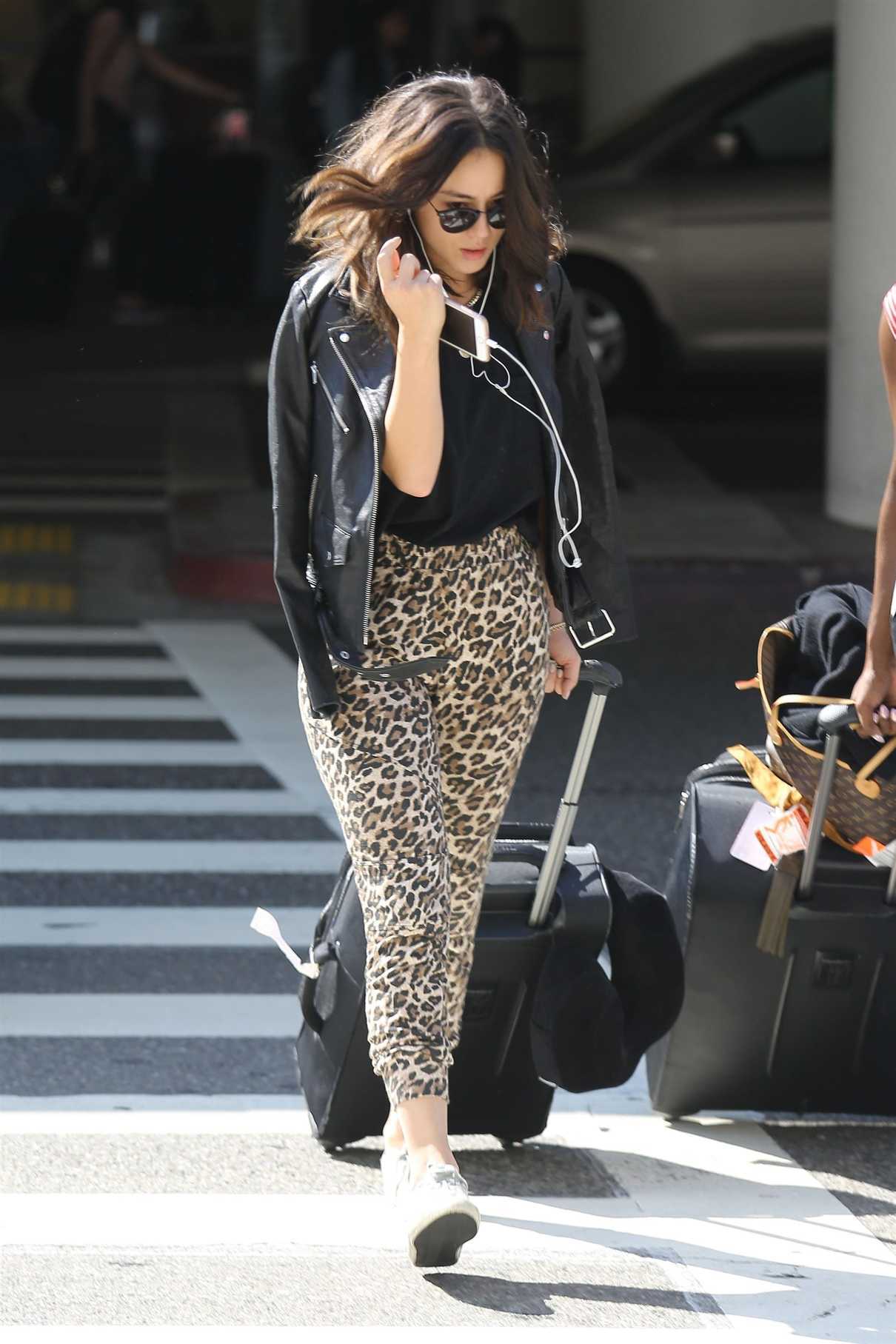 Chloe Bennet Wears a Leopard Print Pants at LAX Airport in LA 09/10/2017-4