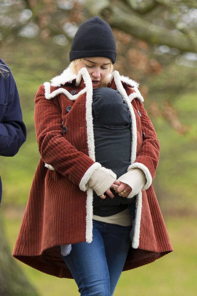 Emilia Clarke Cradles Her Newborn Godson for a Walk Around Hampstead Heath in London 12/17/2017-1