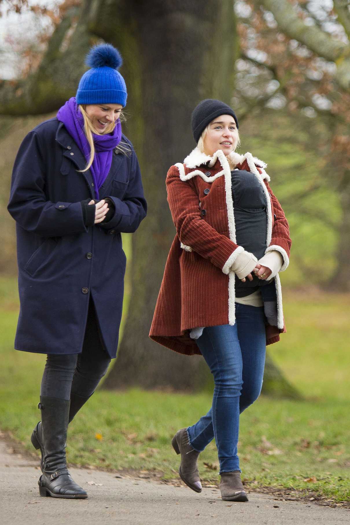 Emilia Clarke Cradles Her Newborn Godson for a Walk Around Hampstead Heath in London 12/17/2017-4