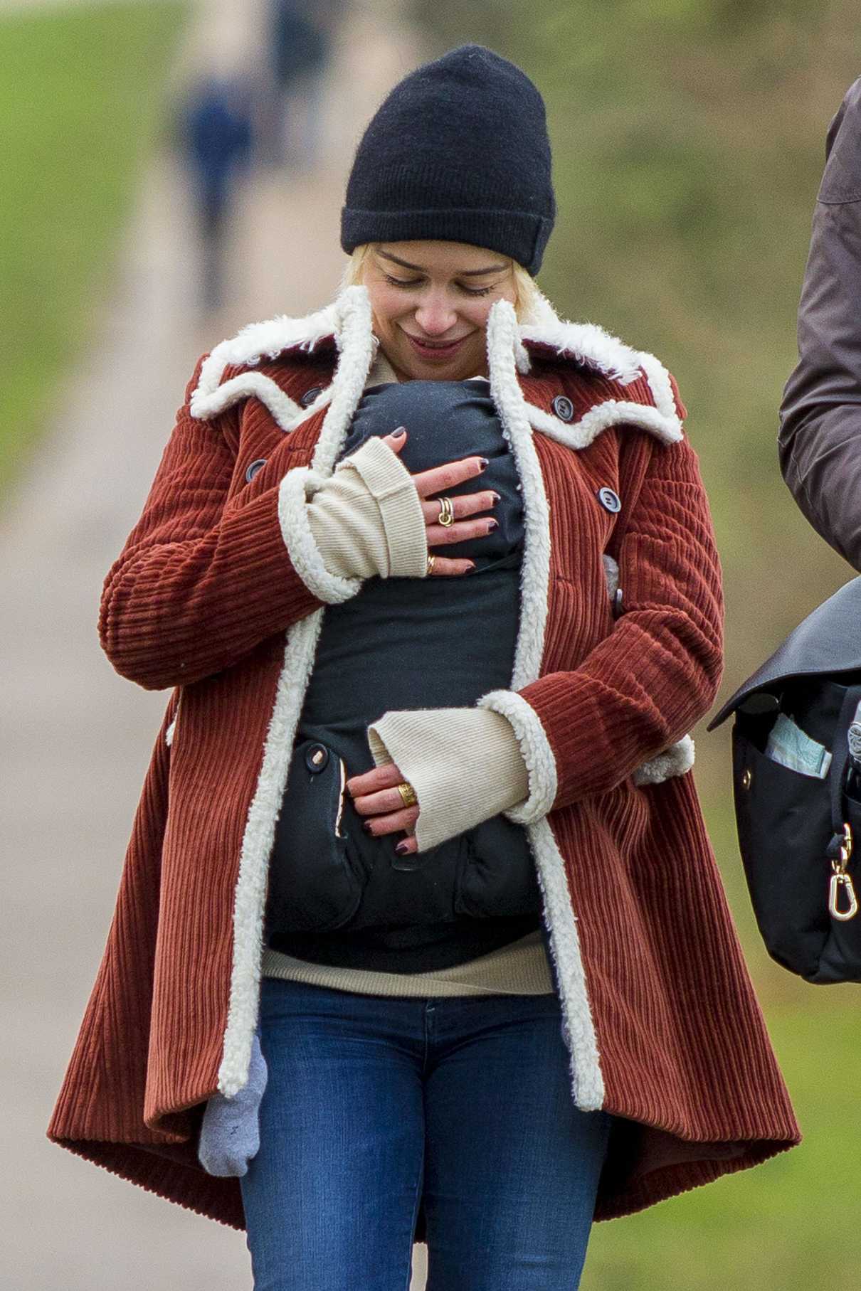 Emilia Clarke Cradles Her Newborn Godson for a Walk Around Hampstead Heath in London 12/17/2017-5