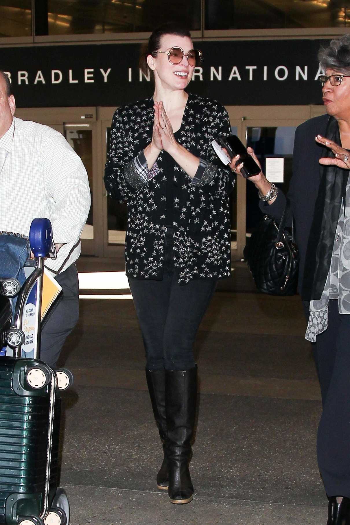Milla Jovovich Arrives at LAX Airport in Los Angeles 12/12/2017-4
