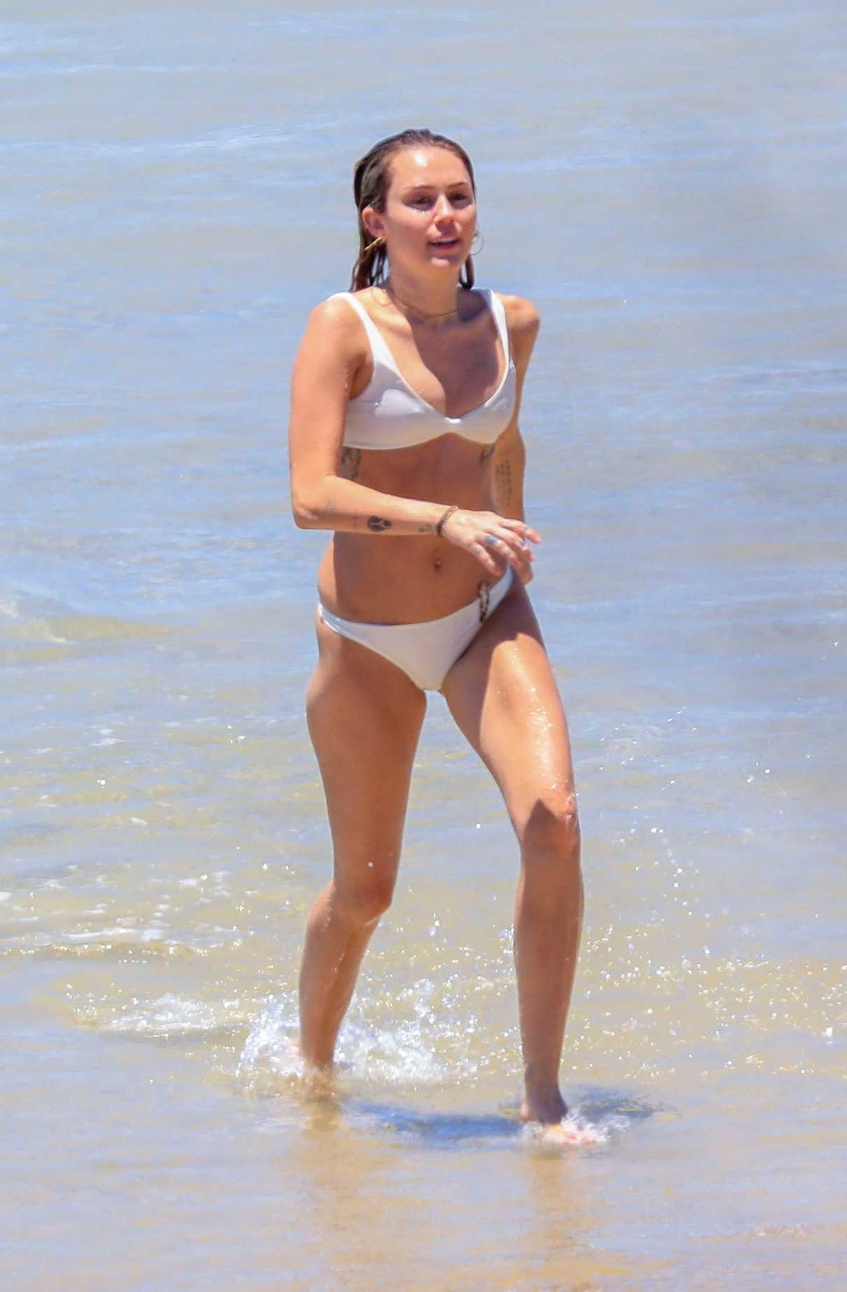 Miley Cyrus in Bikini at the Beach with Liam Hemsworth in Byron Bay, Australia 01/15/2018-2
