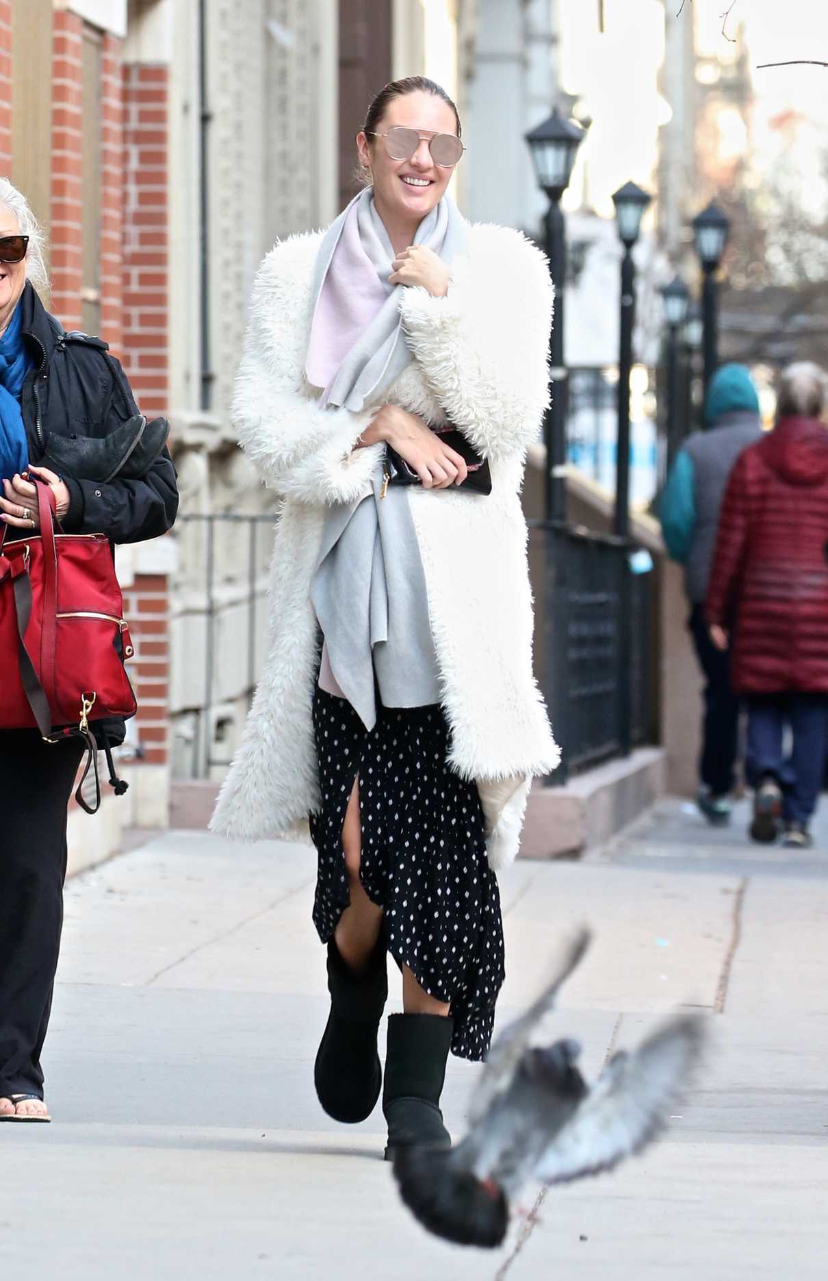 Candice Swanepoel Wears a White Fur Coat Out in New York 03/19/2018-2