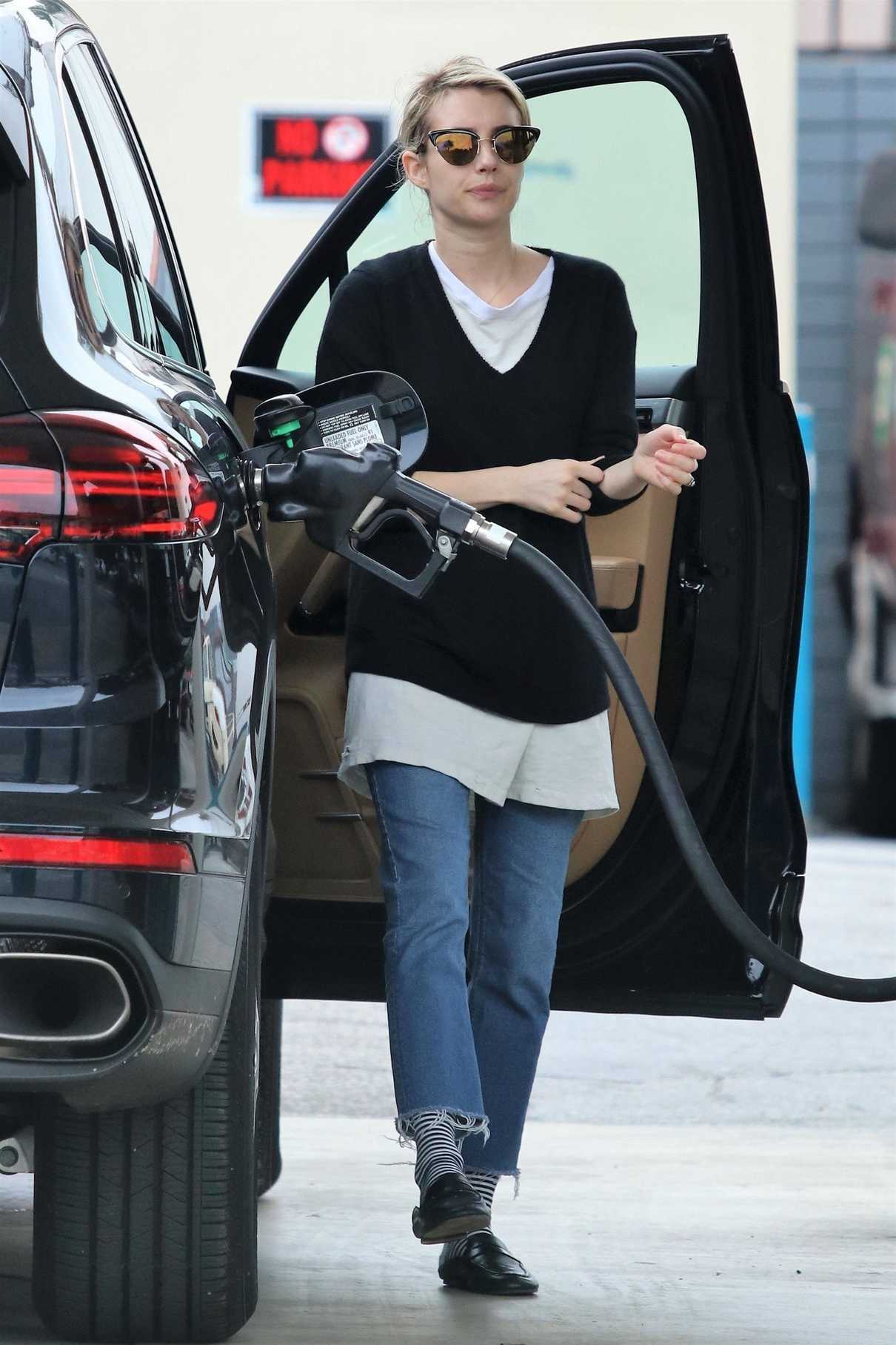 Emma Roberts Stops at a Gas Station to Fill up Her Porsche SUV in Los Angeles 03/13/2018-2