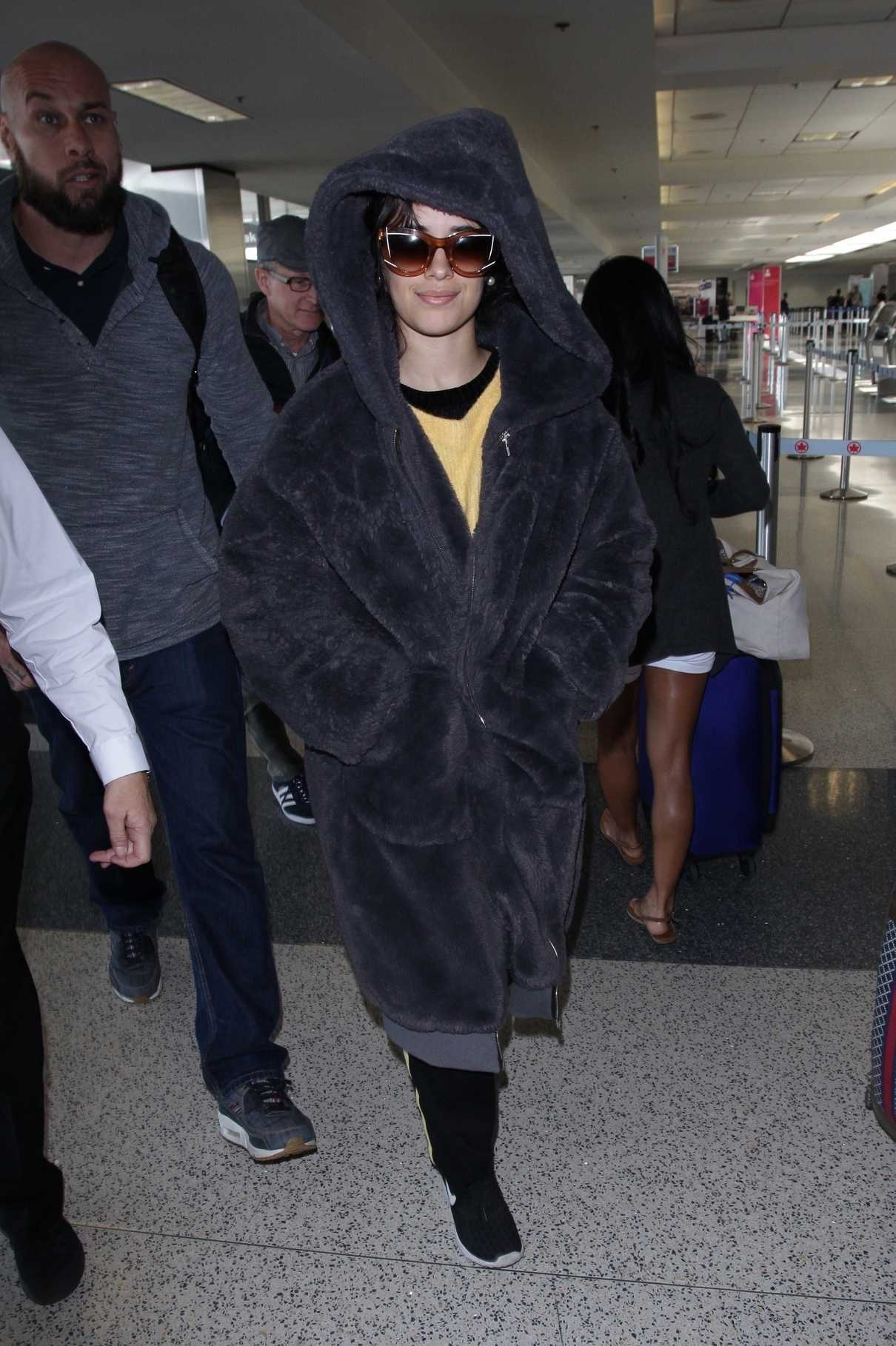 Camila Cabello Wears a Large Fur Coat at LAX Airport in Los Angeles 04/08/2018-2