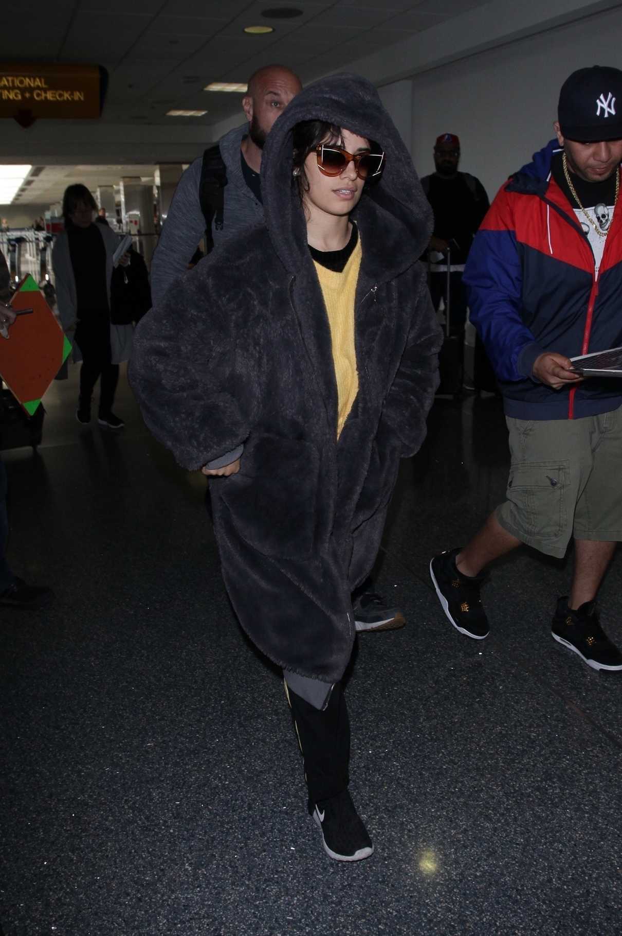 Camila Cabello Wears a Large Fur Coat at LAX Airport in Los Angeles 04/08/2018-3