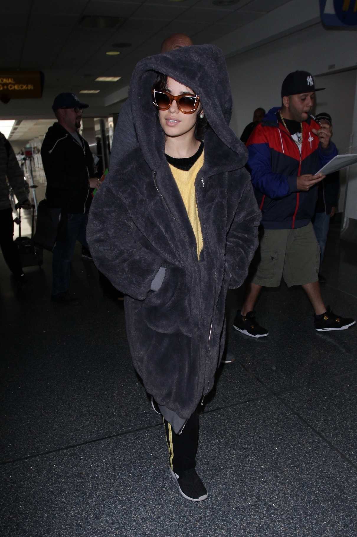 Camila Cabello Wears a Large Fur Coat at LAX Airport in Los Angeles 04/08/2018-4