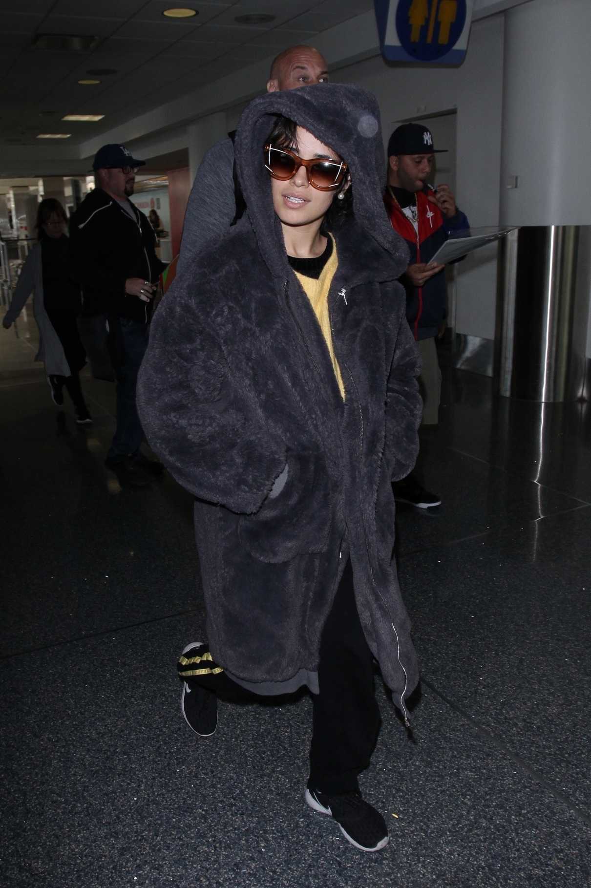 Camila Cabello Wears a Large Fur Coat at LAX Airport in Los Angeles 04/08/2018-5