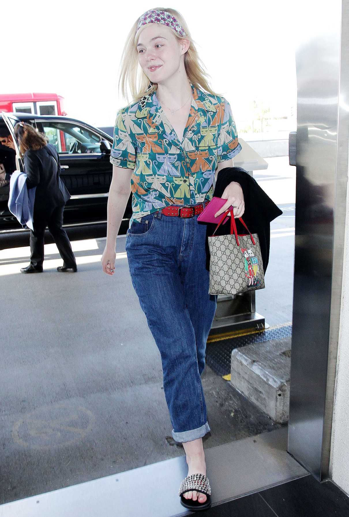 Elle Fanning Wears a Colorful Cat Patterned Shirt at LAX Airport in LA 04/20/2018-3