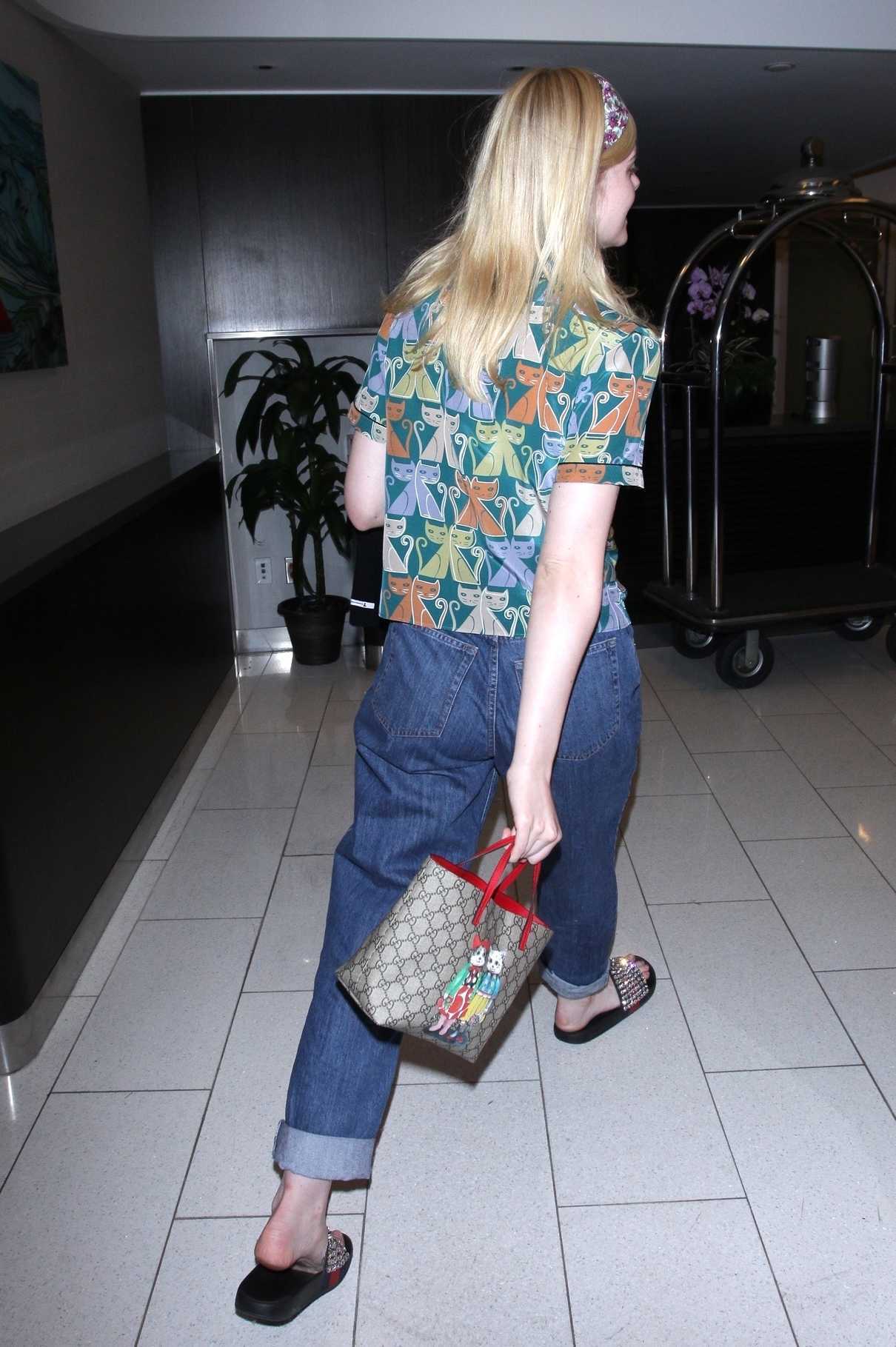 Elle Fanning Wears a Colorful Cat Patterned Shirt at LAX Airport in LA 04/20/2018-5
