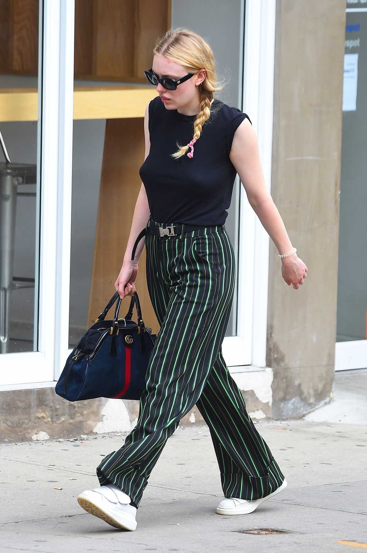 Dakota Fanning Wears a Striped Pants Out in NYC 05/17/2018-5