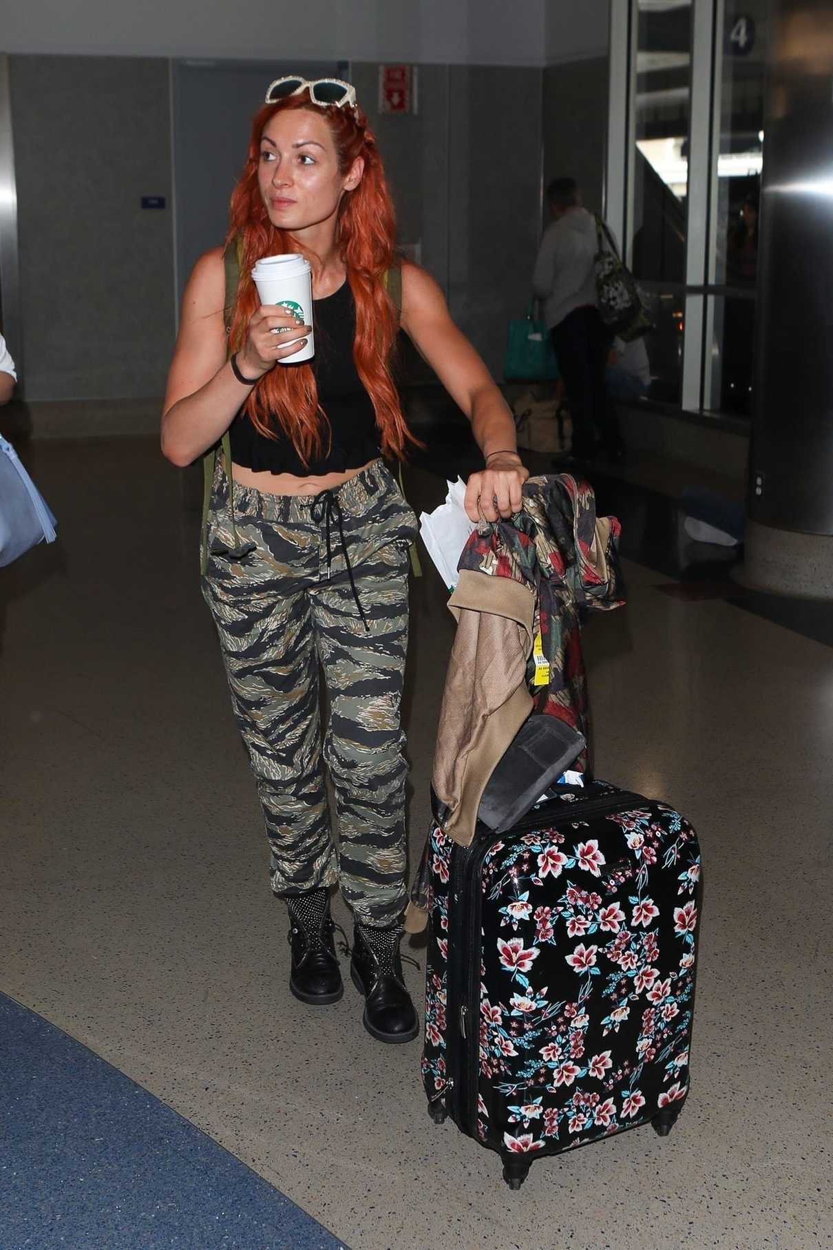 Becky Lynch Enjoys Her Coffee as She Arrives at LAX Airport in Los Angeles 06/06/2018-1