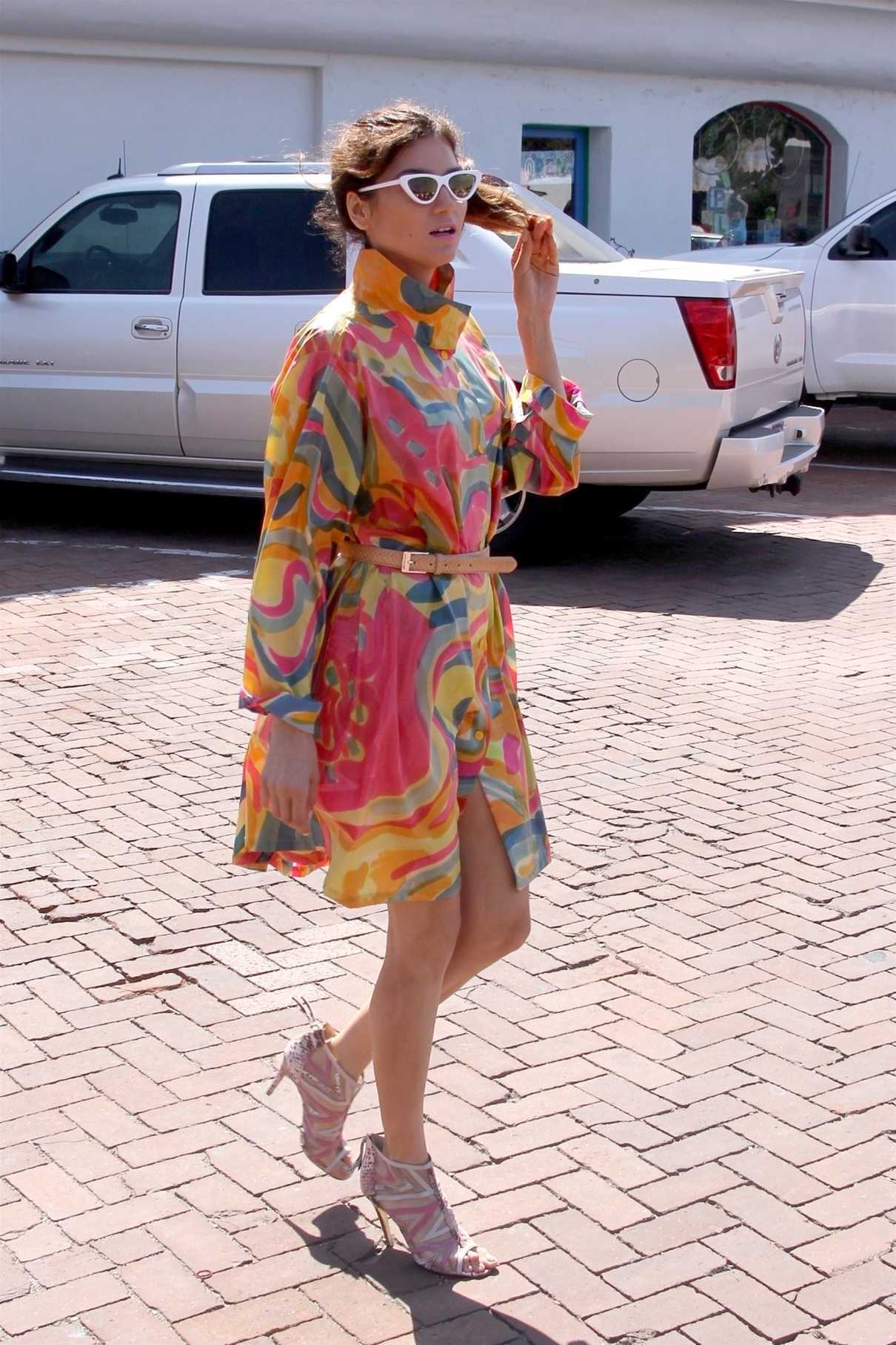 Blanca Blanco in a Bright Wrap Dress