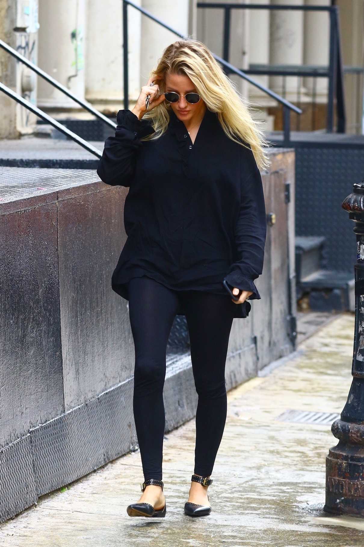 Ellie Goulding in a Black Long Sleeves Blouse