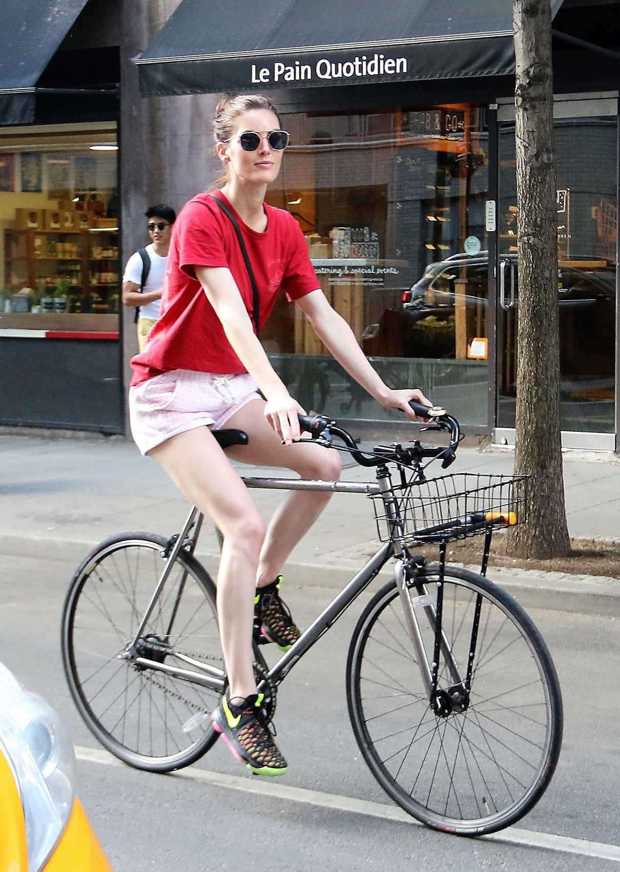 Hilary Rhoda in a Red T-Shirt Rides Her Bicycle in New York City 07/18/2018-4