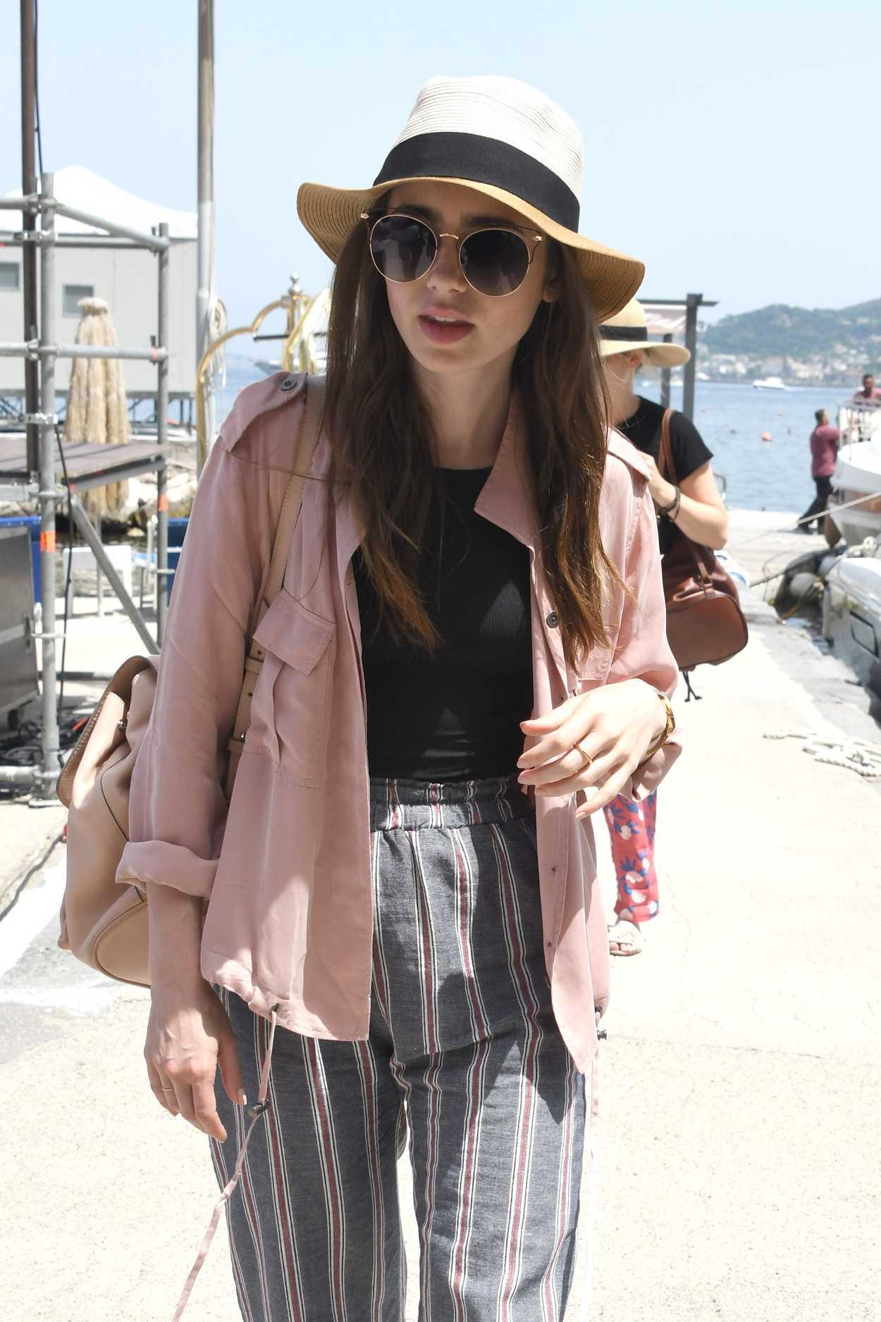 Lily Collins Wears a Pink Jacket as She Arrives at Hotel Regina Isabella in Ischia Porto 07/14/2018-5