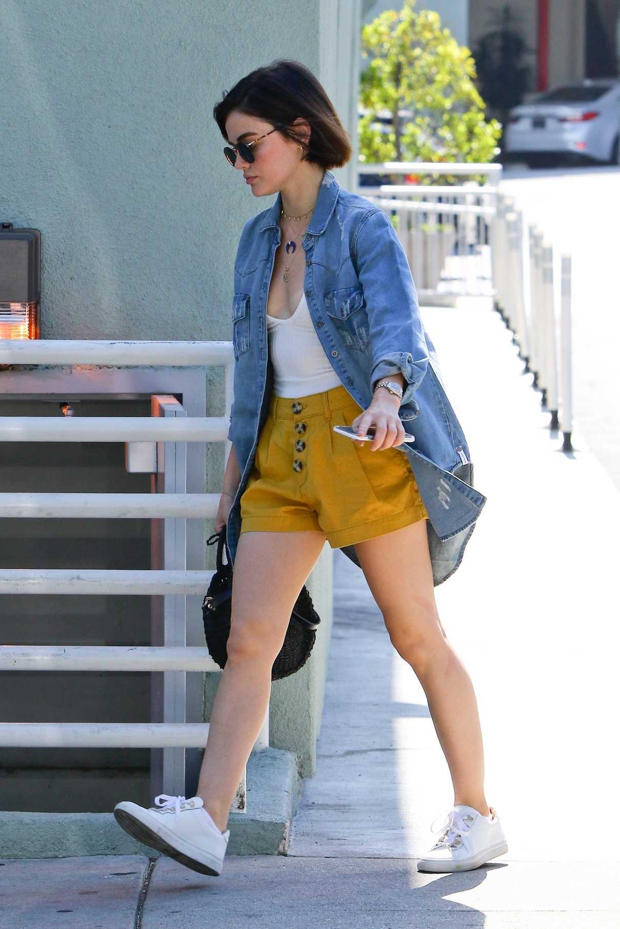 Lucy Hale in a Yellow Shorts
