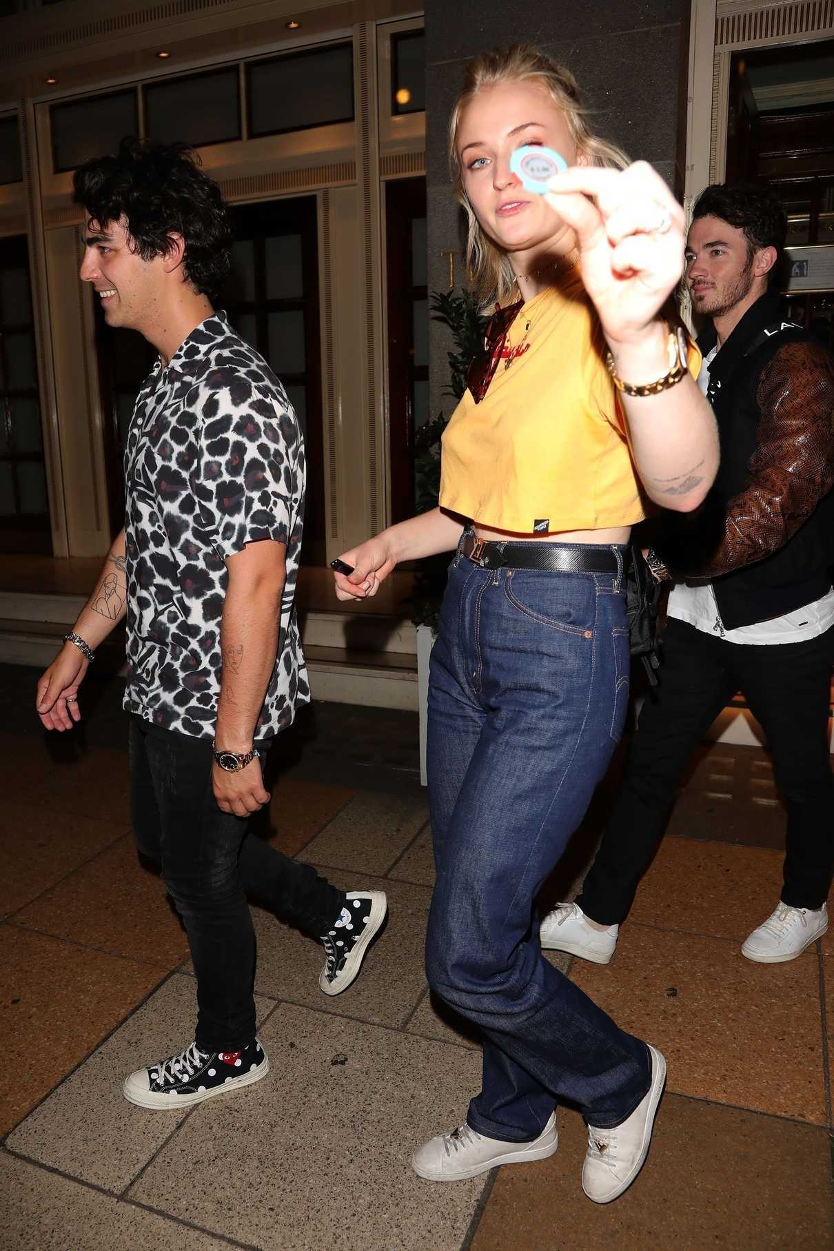 Sophie Turner Wears a Short Yellow T-Shirt as She Leaves the Ritz Club in London 07/17/2018-3