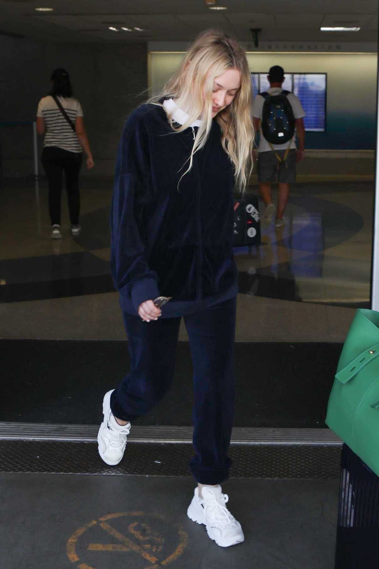 Dakota Fanning in a Blue Tracksuit