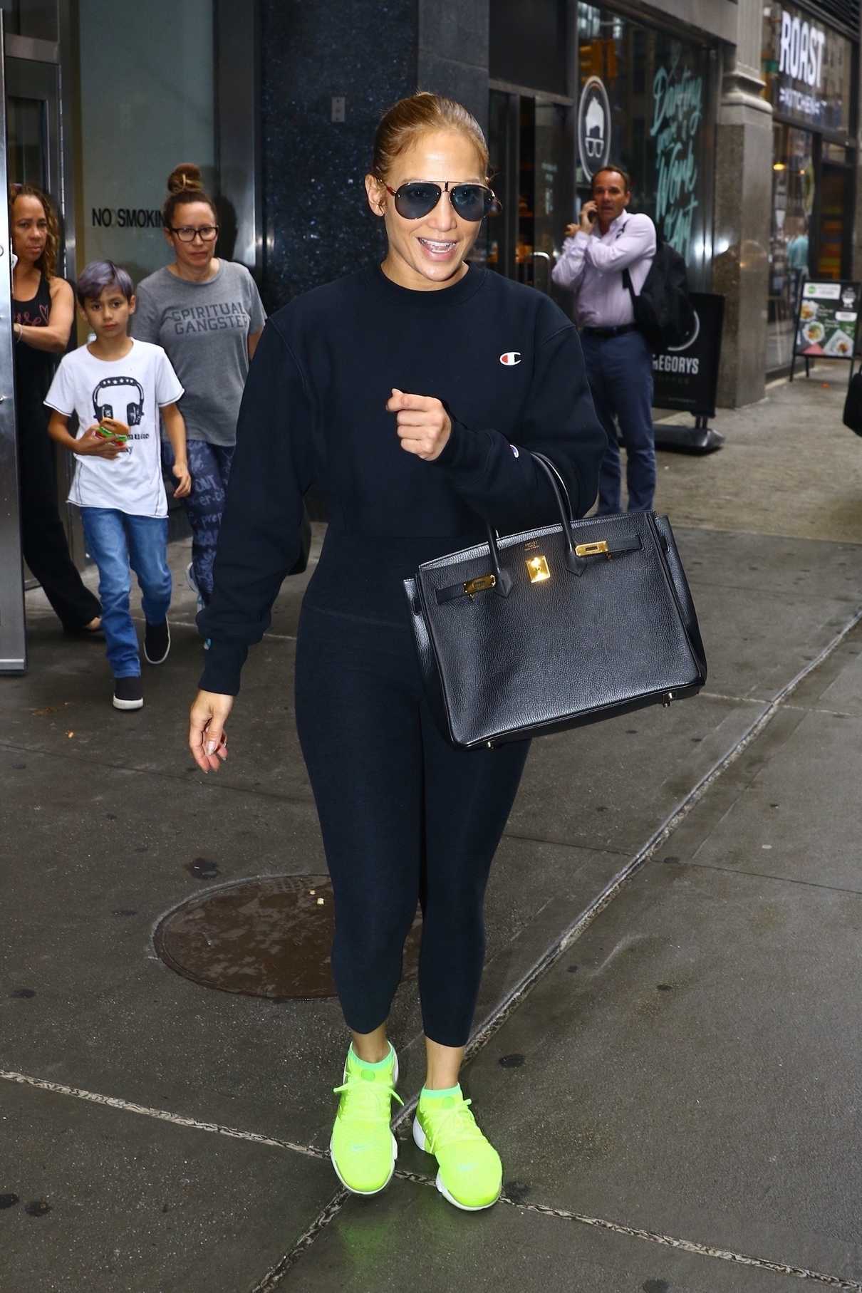 Jennifer Lopez in a Chartreuse Nike Trainers