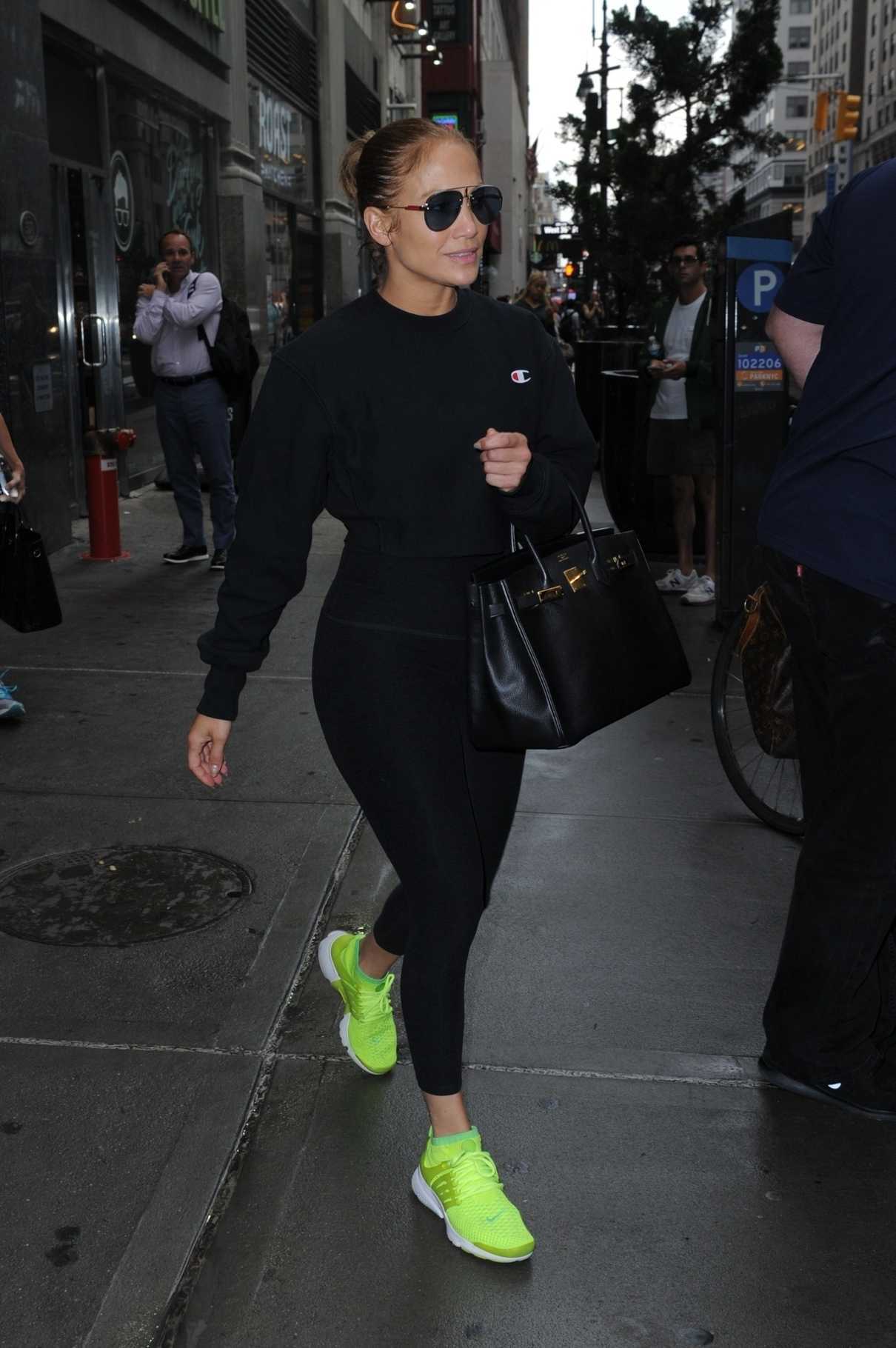 Jennifer Lopez in a Chartreuse Nike Trainers