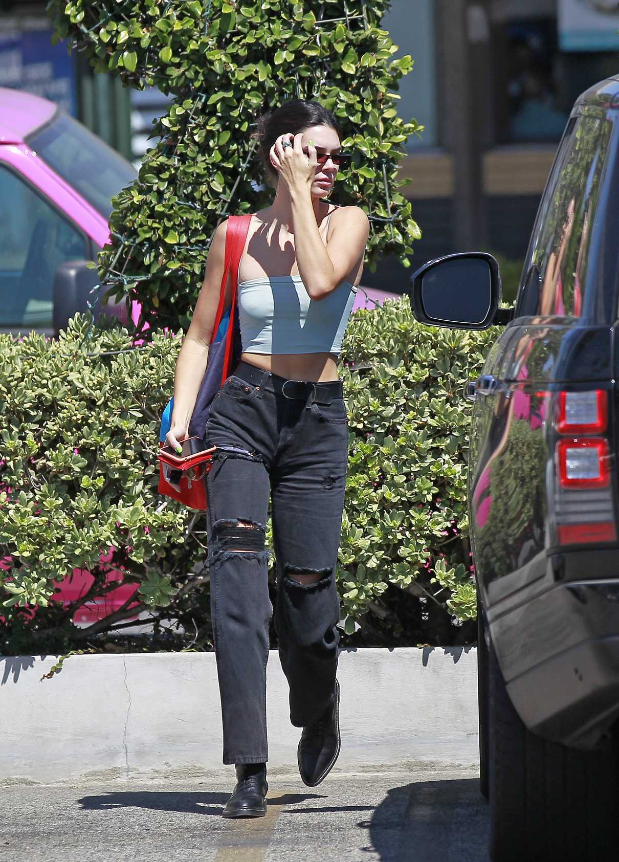 Kendall Jenner in a Black Ripped Jeans Goes Shopping at Opening ...