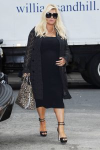 Jessica Simpson in a Black Floral Cardigan
