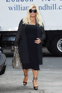 Jessica Simpson in a Black Floral Cardigan