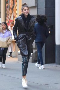 Kaia Gerber in a Black Leather Trench Coat