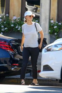 Kaley Cuoco in a White Striped T-Shirt