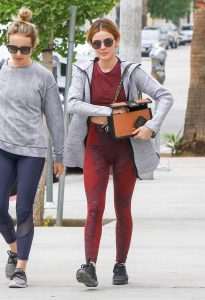 Lucy Hale in a Red Leggings