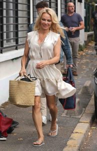Pamela Anderson in a White Snakeskin Dress