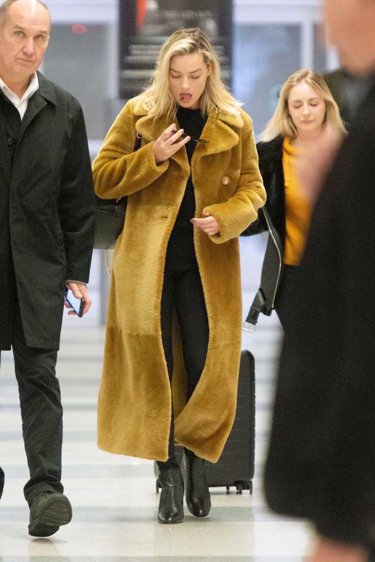Margot Robbie in a Long Yellow Fur Coat Arrives at the JFK Airport in ...