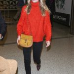 Annabelle Wallis in a Red Sweater Arrives at LAX Airport in Los Angeles 01/16/2019