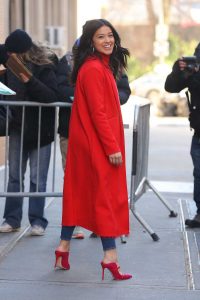 Gina Rodriguez in a Red Trench Coat