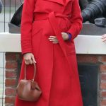 Meghan Markle in a Red Coat Visits the Town of Birkenhead in Merseyside 01/14/2019
