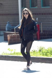 Lily Collins in a Black Bomber Jacket