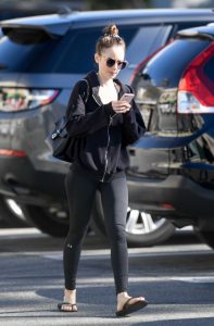 Lily Collins in a Black Hoody