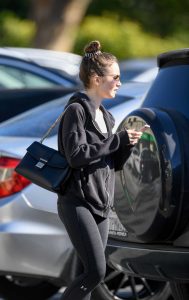 Lily Collins in a Black Hoody